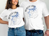 White t-shirts featuring Beaver Lake map graphic with compass and Arkansas text.