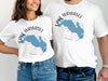 White t-shirts featuring a blue map of Lake Wawasee, Indiana with compass rose design.