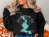 Black sweatshirt with compass and map of Mooselookmeguntic Lake, Maine