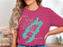 Lake Placid New York map graphic with compass on a pink t-shirt.