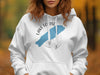 White hoodie with "Lake Louise Banff" text and blue lake outline graphic.