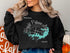 Black sweatshirt featuring a compass rose graphic and "Beautiful Wright Patman Lake Texas" text.