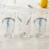 Three clear glasses featuring "Lake Champlain Vermont" text, a compass, and a blue map graphic.