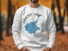 White sweatshirt with blue Timothy Lake Oregon map and compass graphic.