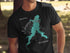 Black t-shirt with a teal map outline and compass rose graphic.