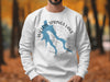 White sweatshirt on a man with Willow Springs Lake Arizona map logo and compass design.