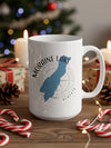 White mug with Moraine Lake Alberta graphic and compass design.
