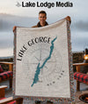 Tapestry blanket with Lake George map, compass, and New York text.