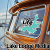 Turquoise map sticker with "Hayden Life" text on a boat window.