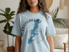 Oologah Lake Oklahoma map and compass t-shirt design on a light blue shirt.