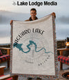 Man holding Saguaro Lake Arizona map blanket with compass design.