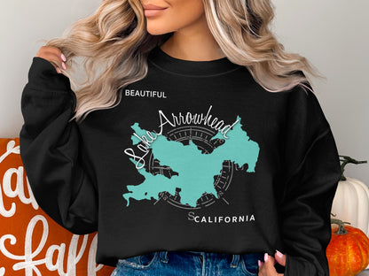 Black sweatshirt with teal Lake Arrowhead map and compass graphic.