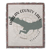Harlan County Lake Nebraska map with compass and lake name on a fringed throw.