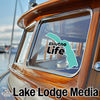 Sticker with turquoise outline of Alaska and text Eklutna Life on boat window.