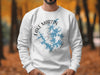 White sweatshirt with Lake Martin Alabama map design and compass graphic.
