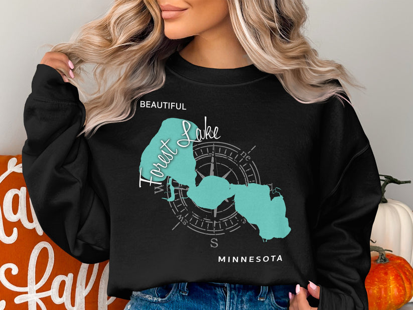 Black sweatshirt with "Beautiful Forest Lake" text and Minnesota map graphic.
