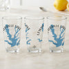 Three clear glasses feature a blue map of Lewisville Lake, Texas, with compass rose and text.