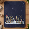 Fishing-themed Christmas scene with bears and snow on a navy blanket.