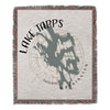 Woven blanket with lake Tapps Washington map and compass design.