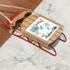 Wooden sled ornament with "Merry Christmas from Madison Lakes" text and map graphic.