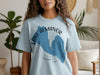 Light blue t-shirt featuring a blue outline of Lake Almanor, California.