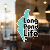 Turquoise outline of Long Pond Life text on window, with copyright Lake Lodge Media LLC.