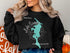 Black sweatshirt with Lake Sunapee, New Hampshire map and compass graphic.