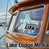 Turquoise Stockton Life sticker on boat window with "Lake Lodge Media" logo.