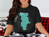 Black t-shirt with turquoise Lake Piru outline and compass graphic.