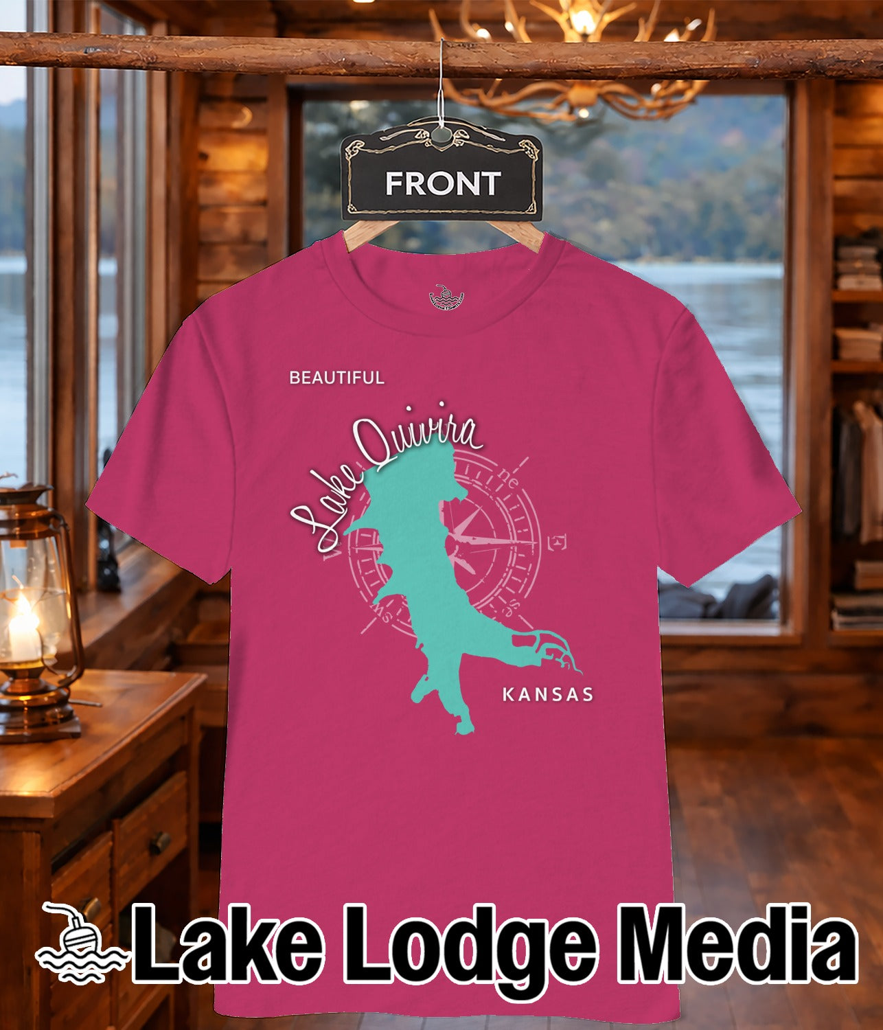 Pink t-shirt with a turquoise map outline of a lake and the text "Lake Quivira KANSAS" above "Lake Lodge Media".