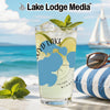 Drink with lime and mint on beach with sailboat, sunglasses, and "Lake Lodge Media" text.