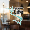 Sonoma Life sticker featuring a teal lake outline and text.