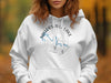 White hoodie with compass design and "Taylorsville Lake Kentucky" text.