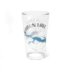 Clear glass pint glass with Rathbun Lake Iowa map and compass design.