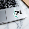 Teal lake outline sticker with "Tillery Life" text on a laptop.