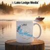 White mug with "Rainy Lake Minnesota" and compass graphic on a lake background.