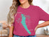Pink t-shirt with a compass rose graphic and "Lake Willoughby Vermont" text.