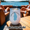 A white tumbler with Lake Derwentwater, England printed on it rests on a wooden boat table.