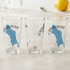 Three clear glasses feature the blue silhouette of Jordan Pond, Maine with compass rose graphics.