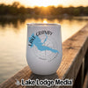 A white insulated tumbler featuring a blue map of Lake Granby, Colorado, resting on a wooden dock.