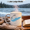 White mug with Lake Erie map and compass design, steaming hot.