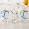 Three clear glasses with blue Lake Coeur d'Alene map and compass designs.