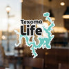 Texoma Life sticker featuring a teal lake outline and black text.