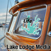 Lewisville Life sticker on a boat window with Lake Lodge Media logo.