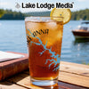 Glass with Lake Anna map and compass design, iced tea, lemon slice.
