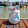 A white insulated wine tumbler with a Lake Gregory California map graphic sitting on a wooden boat deck.