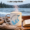 White mug with Reelfoot Lake map and Tennessee text on a rainy day.