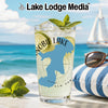 Glass with lake shape, limes, mint, and "Lake Lodge Media" text.