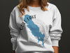 White sweatshirt with blue Gull Lake, Michigan map and compass design.