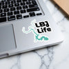 "LBJ Life" sticker with a turquoise lake outline on a laptop.